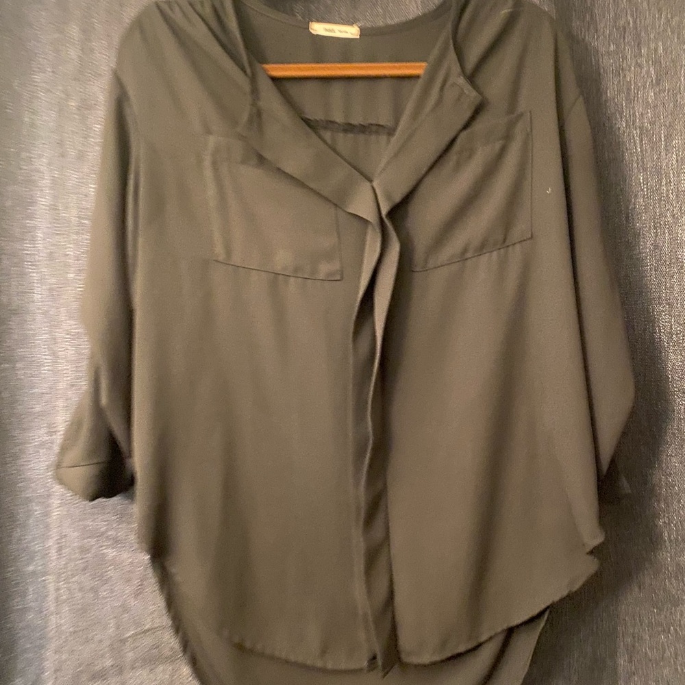 Black blouse size small, sleeves are scrunched up. Slightly high low